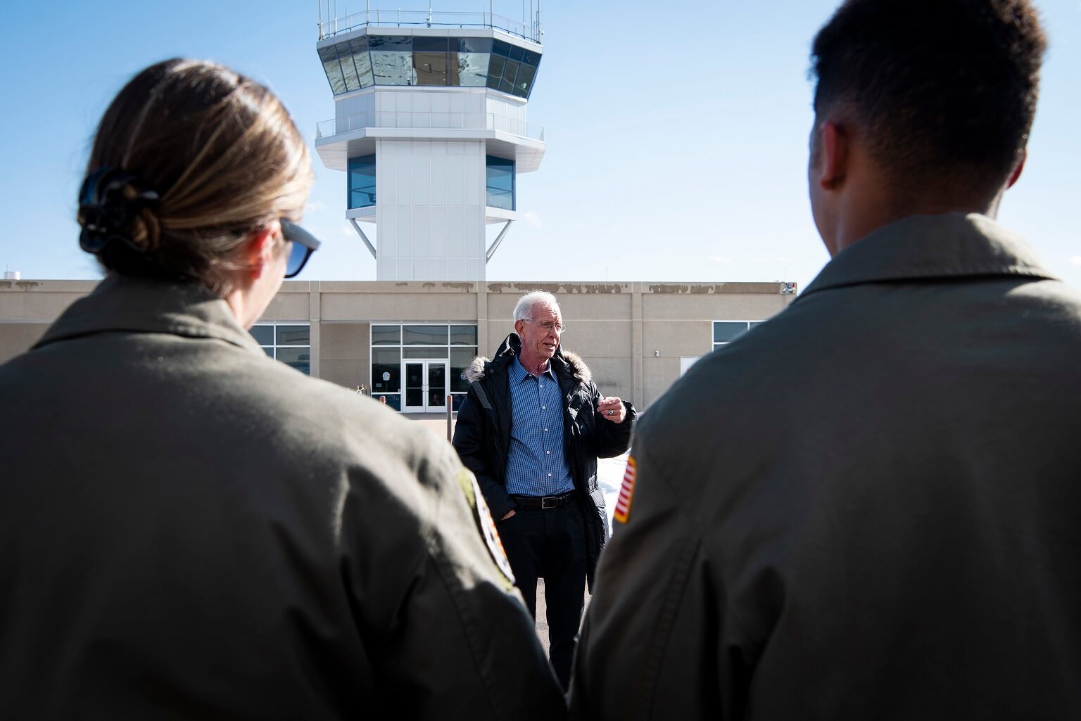 Sullenberger speaks to members of the 94th FTS in front of the Davis Airfield’s control tower.