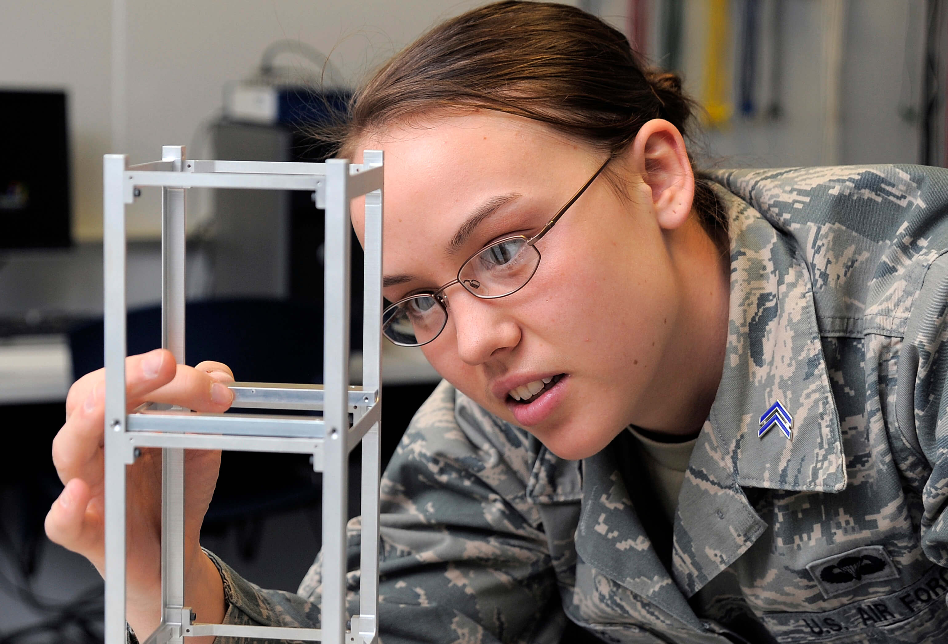 Cadet 1st Class Heather Nelson works on the FalconSat 7 project March 6, 2012.