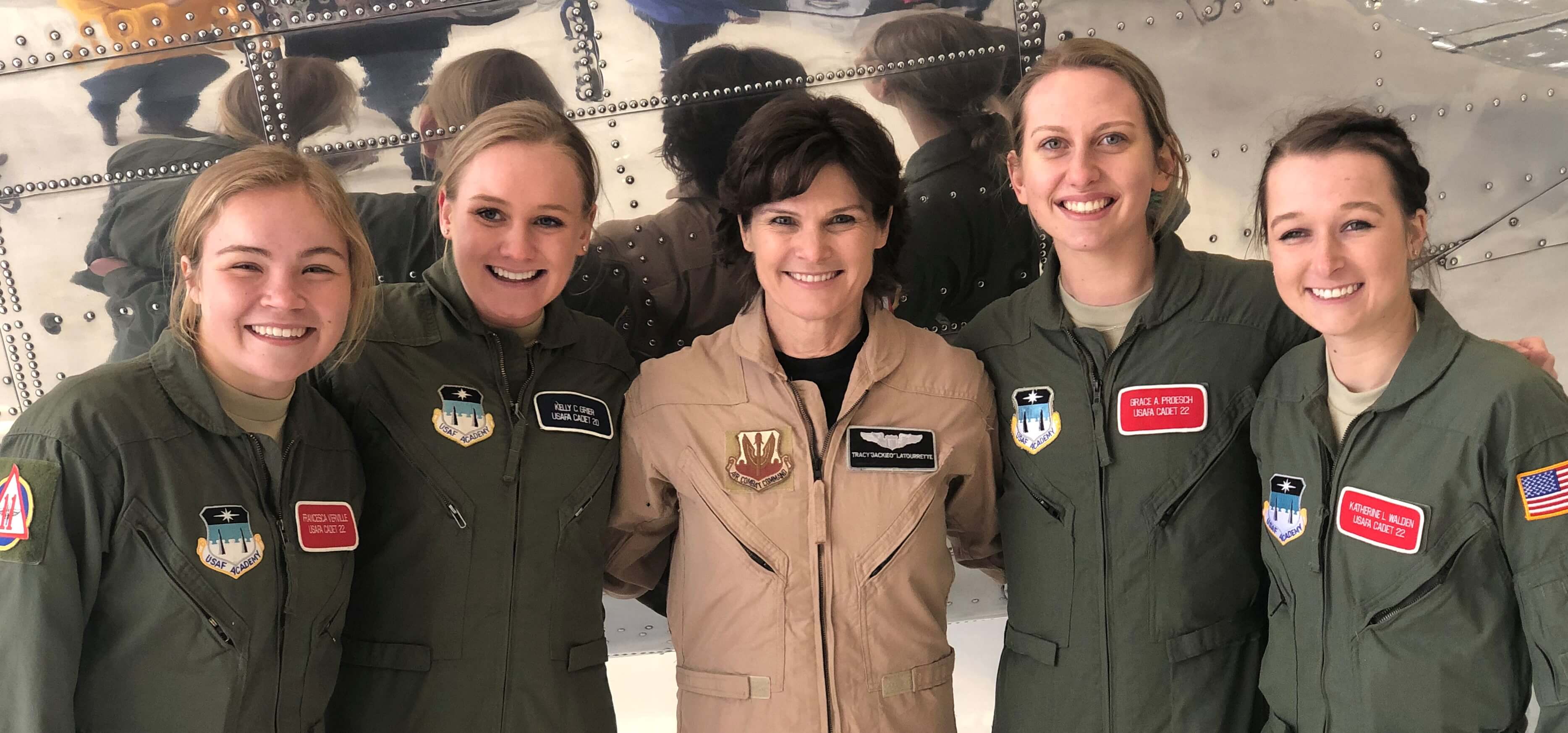Image of Tracy LaTourrette and four female cadets in flight suits