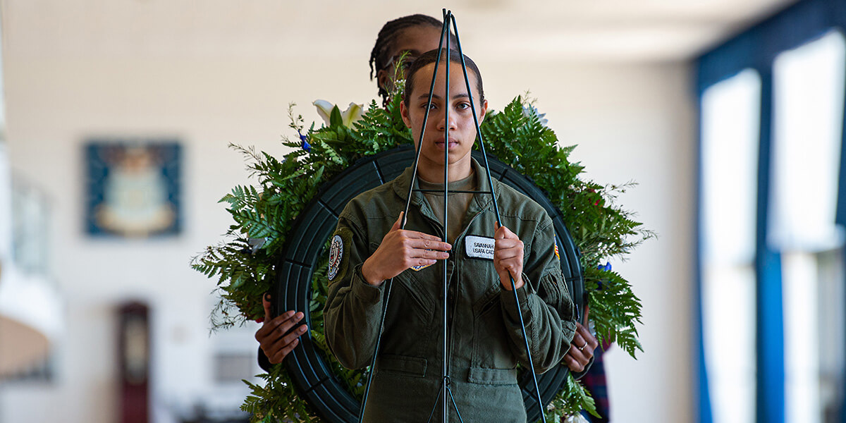 cadet with wreath at Tuskegee ceremony