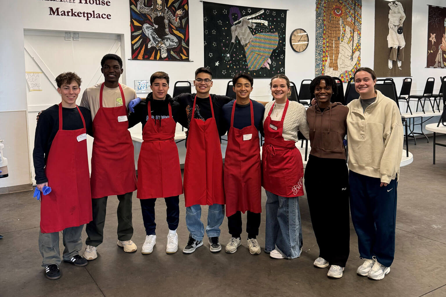 U.S. Air Force Academy boxing team cadets (from left to right) James Burnias, Samuel Banduah, Freddy Ceciliano, Sebastyan Correa Rios, Duong (Youngie) Tran, Billie Botes, Naomi Brabham, and Katie Beavis pose for a photo after volunteering at the Catholic Charities of Central Colorado’s Marian House Kitchen.