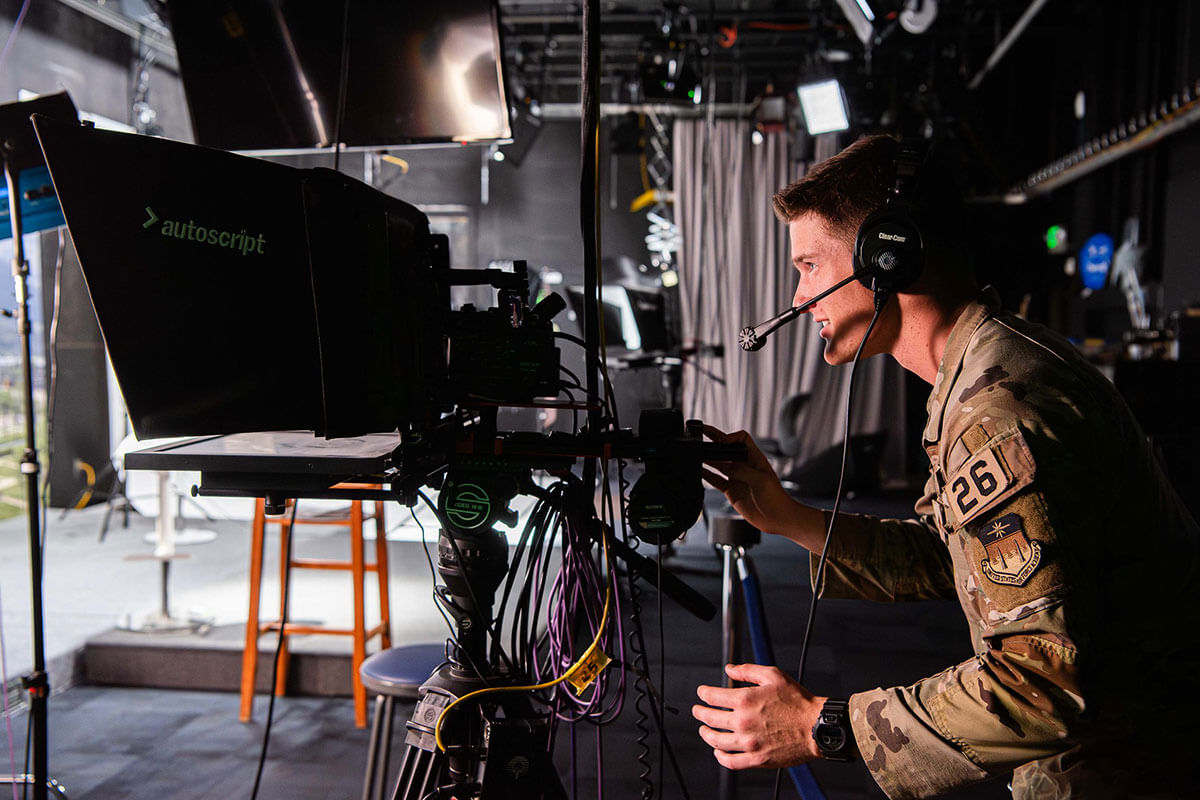 A Cadet working in the studio in the broadcast booth.