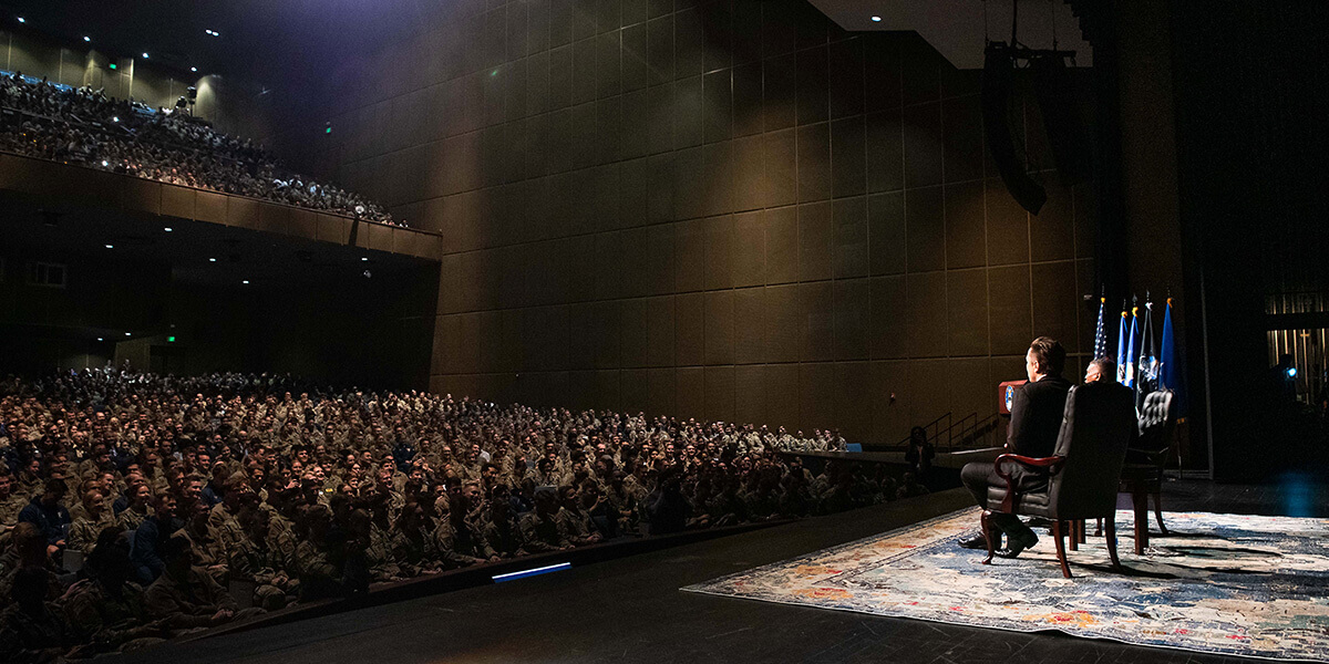 A lecture is given at Arnold Hall Theater.