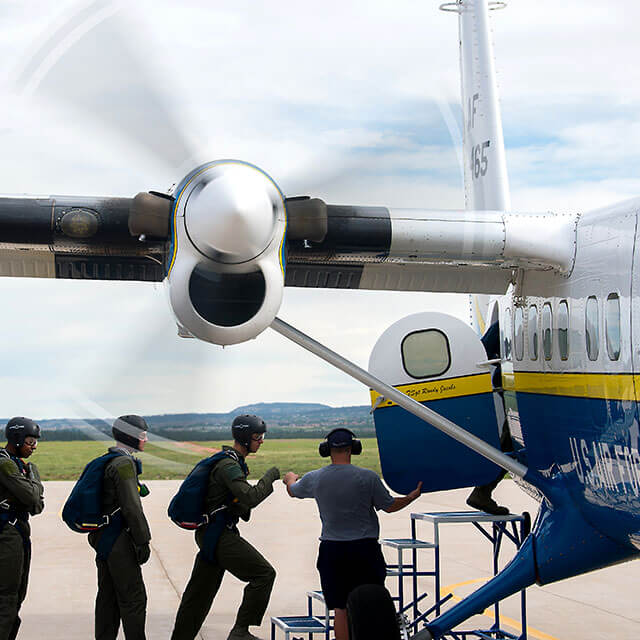 Cadets boarding skydiving plane.