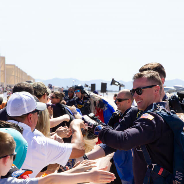 Wings of Blue members meeting spectators