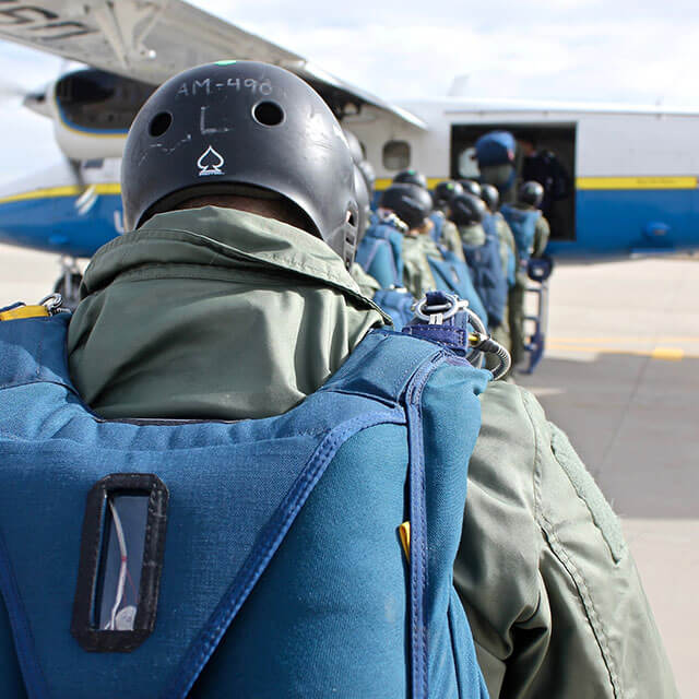 Cadets boarding skydiving plane.