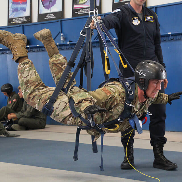 Cadet suspended in harness.