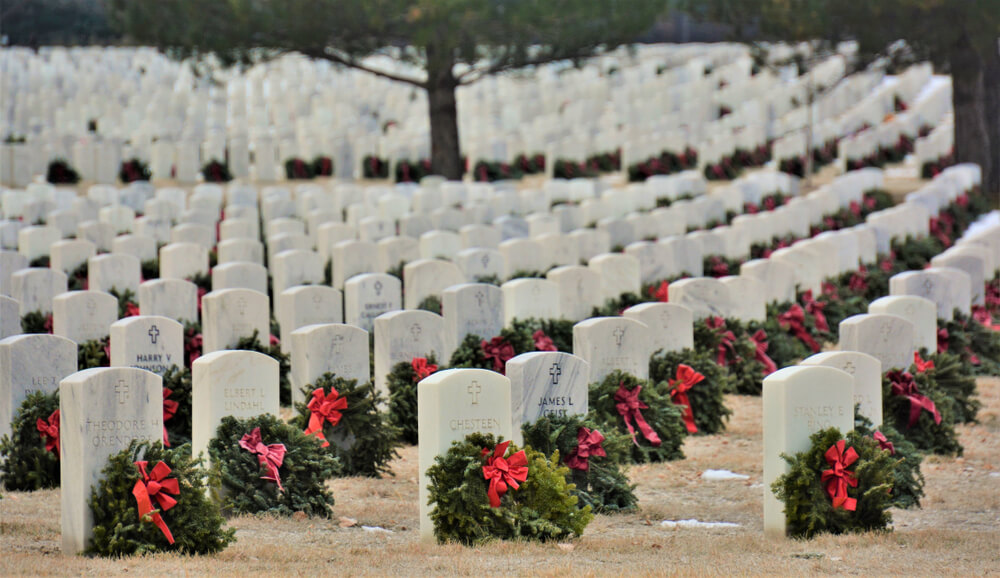 Cemetery headstones with wreaths