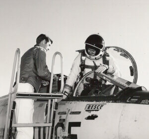 Pilot getting into plane