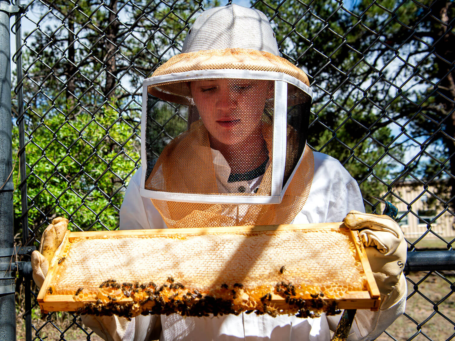 Cadet holding a honeycomb.