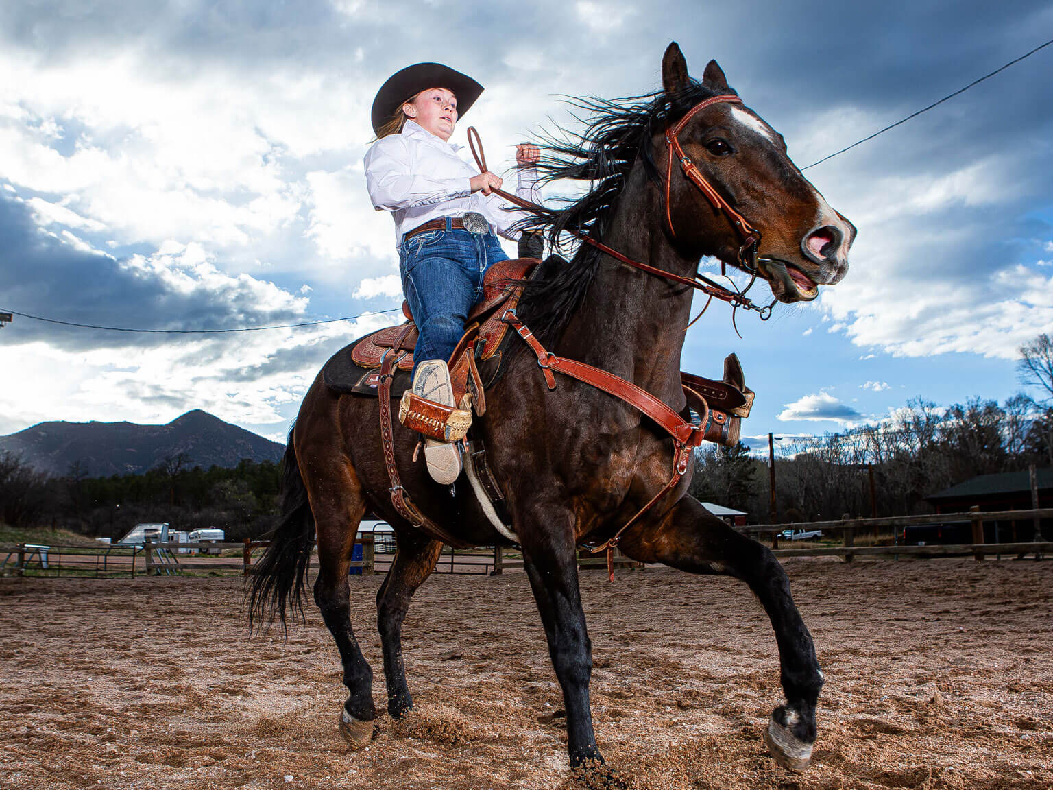 Cadet 2nd Class Colette McClanahan brings her horse, Bear, to a stop in the U.S. Air Force Academy Rodeo Club arena.