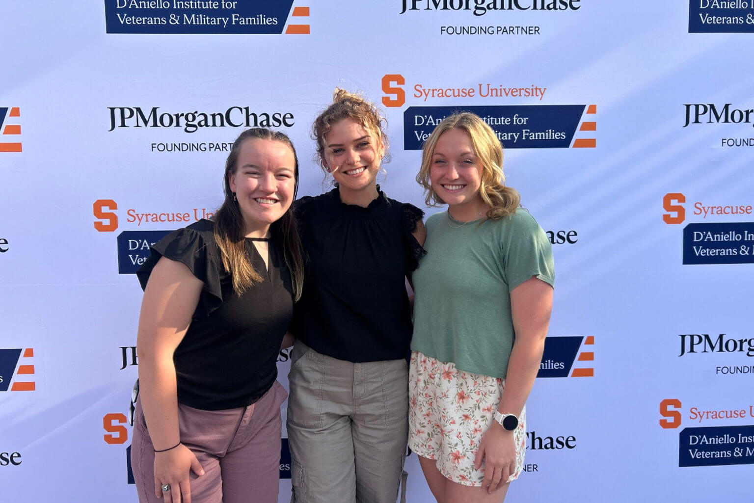 Cadet 1st Class Scarlet Nation, left, program sponsor Ellie Huth, middle, and Cadet 2nd Class Sophie Kent, right, attend an Institute for Veterans and Military Families retirement ceremony at Syracuse University, Syracuse, New York.