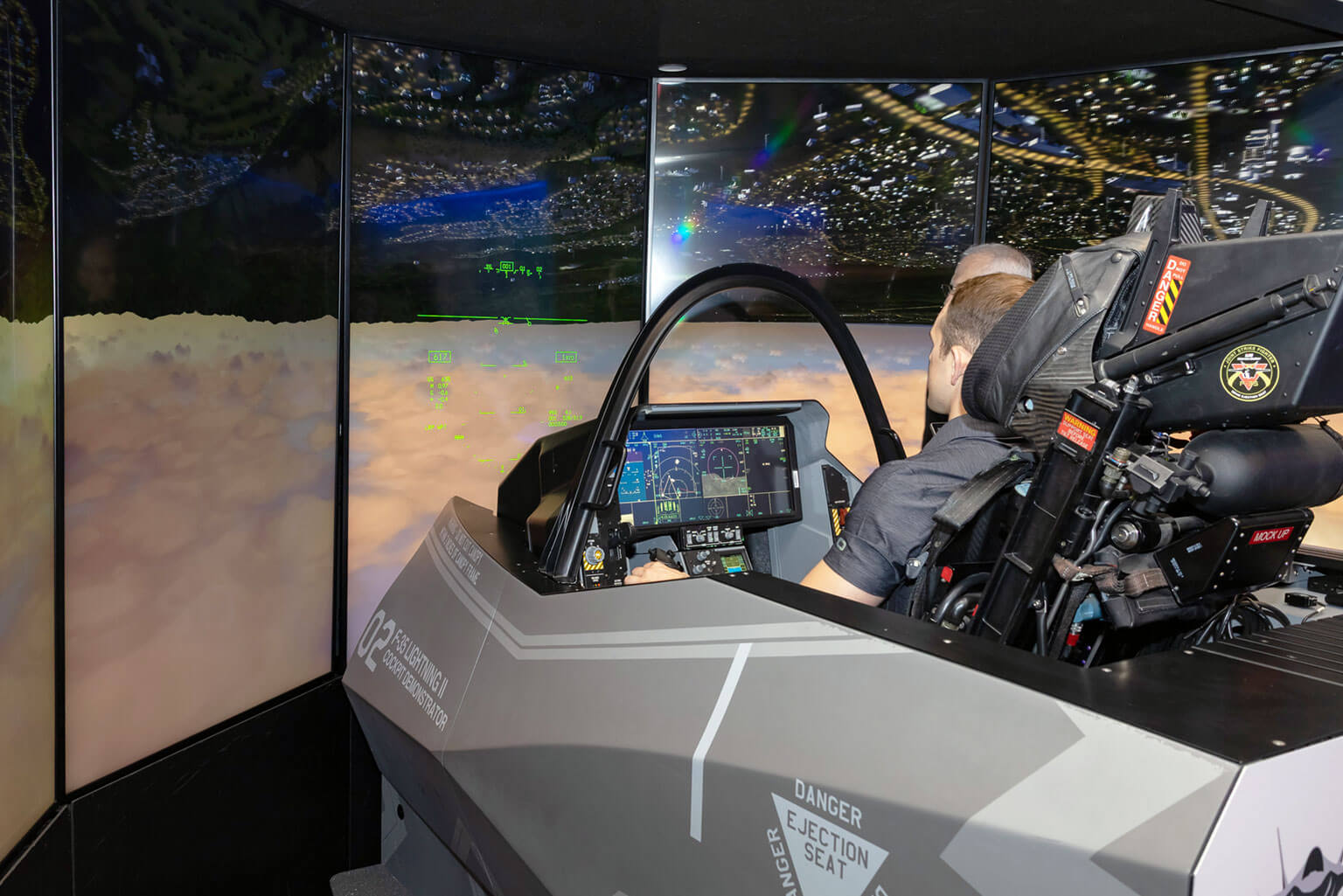 Cadet 1st Class Garrett Clark operates an F-35 simulator during his Cadet Summer Research Program 2026 experience at Lockheed Martin in Fort Worth, Texas. In addition to contributing to the ePilot research project, Clark gained exposure to aerospace engineering and aircraft design through hands-on experiences with industry professionals. (Photo courtesy of Garrett Clark)