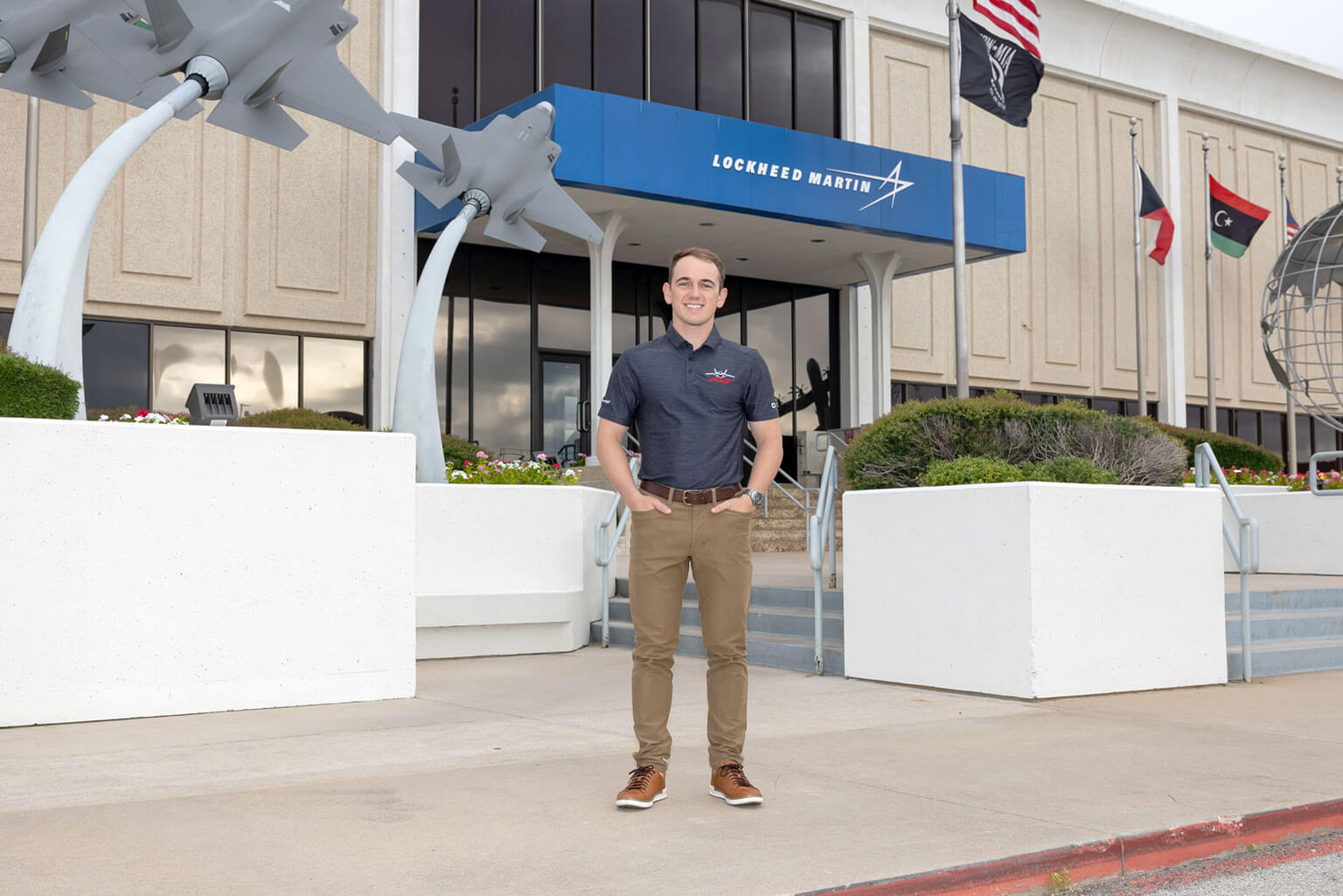Cadet 1st Class Garrett Clark poses at Lockheed Martin in Fort Worth, Texas, where he participated in the Cadet Summer Research Program 2026. Clark collaborated on the ePilot project, using Model Based Systems Engineering to help develop a virtual copilot concept designed to improve pilot awareness, safety and mission effectiveness. (Photo courtesy of Garrett Clark)