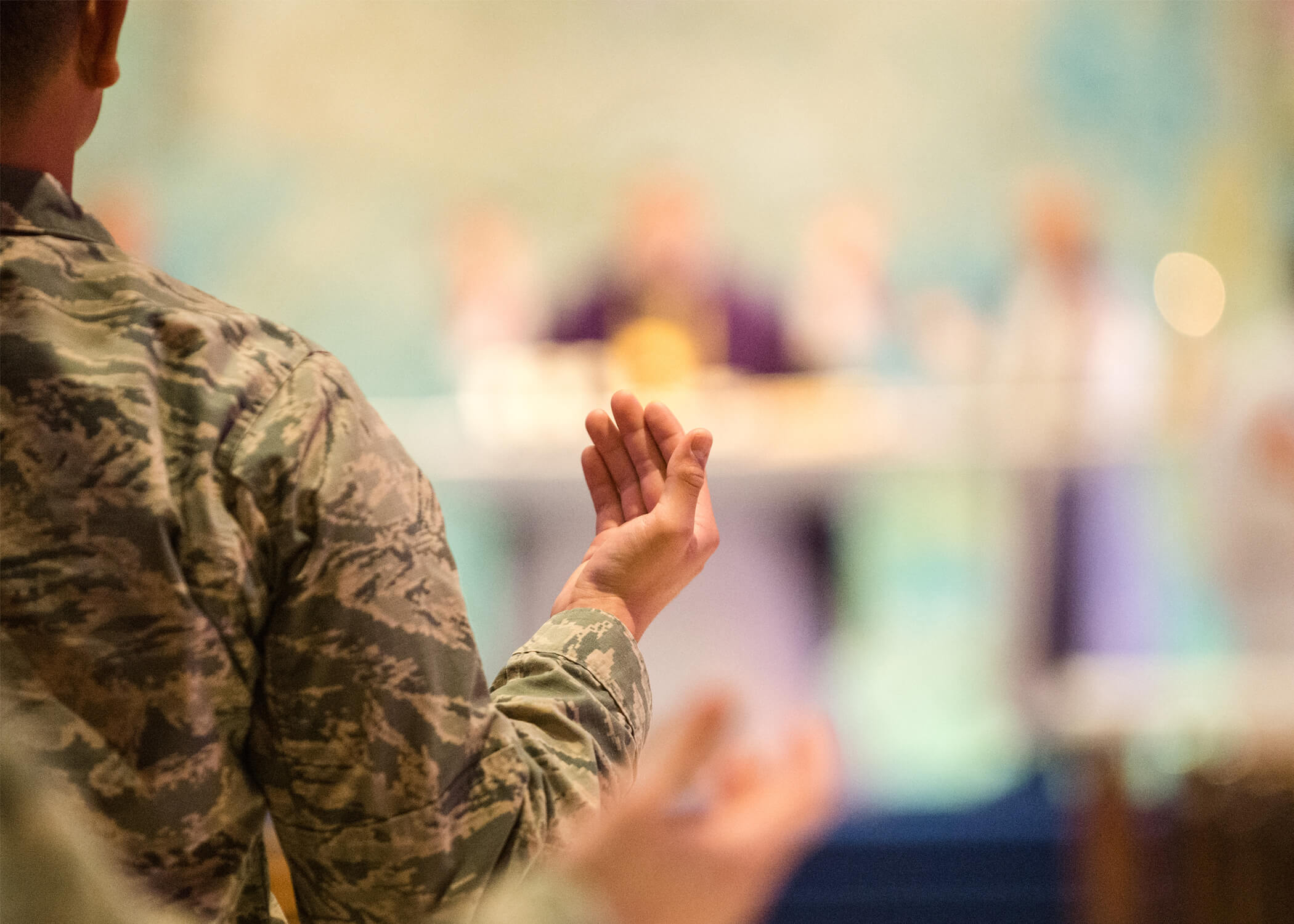 Image of cadet in prayer at the U.S. Air Force Academy.