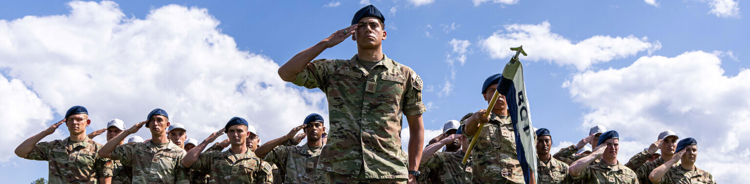 Cadets in formation and saluting.