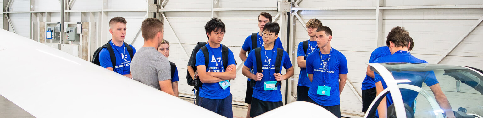 Student participants visit the cadet airmanship program at the cadet airfield during Summer Seminar at the U.S. Air Force Academy.