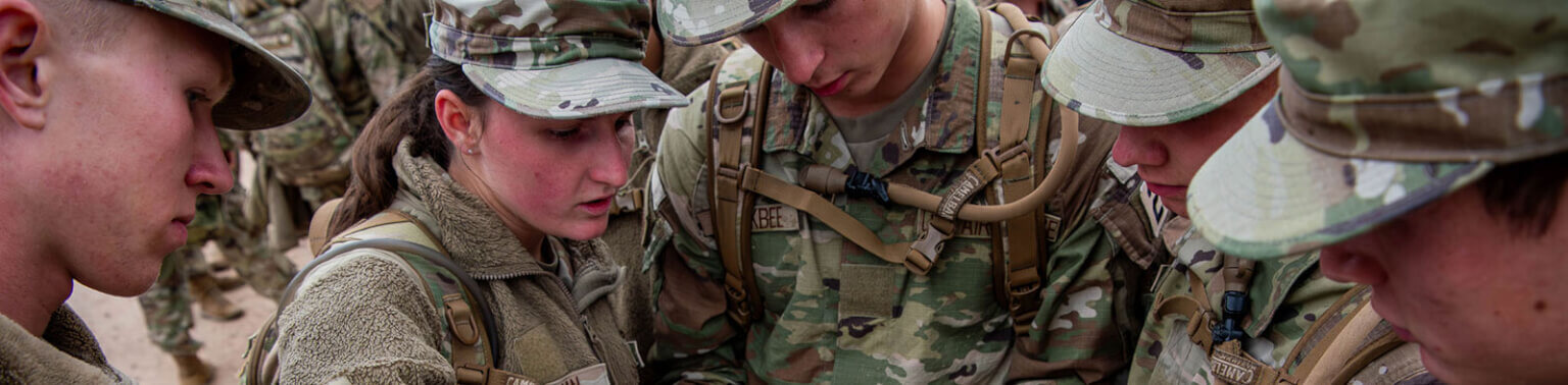 Cadets reviewing military maneuvers.