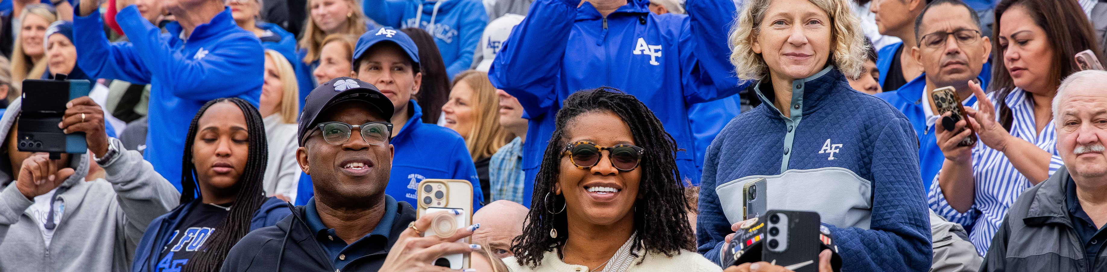Parents cheering their cadets at the Parents' Day Parade at Stillman Field.