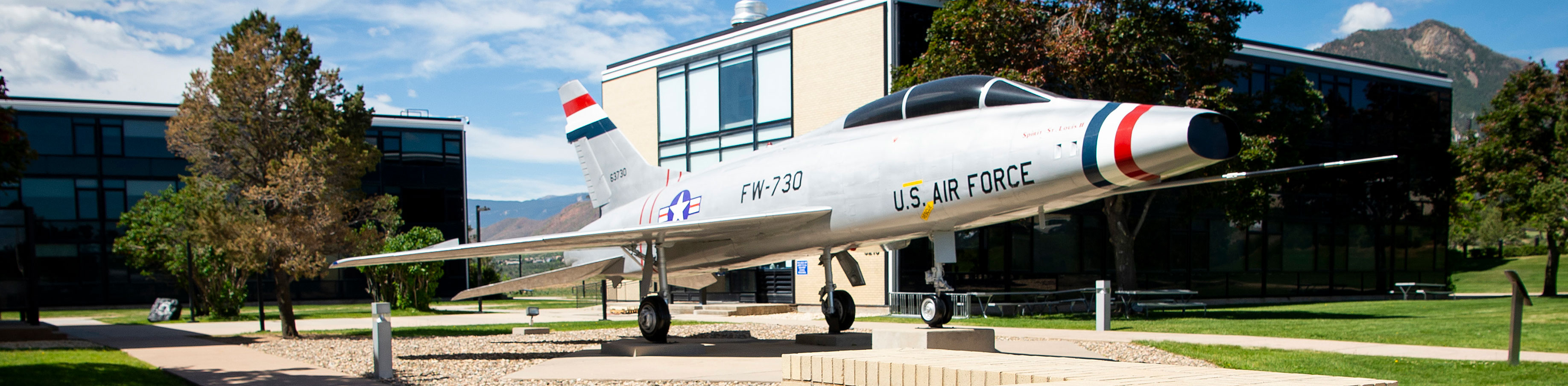 North American F-100 Super Sabre in front of Prep School Academy.