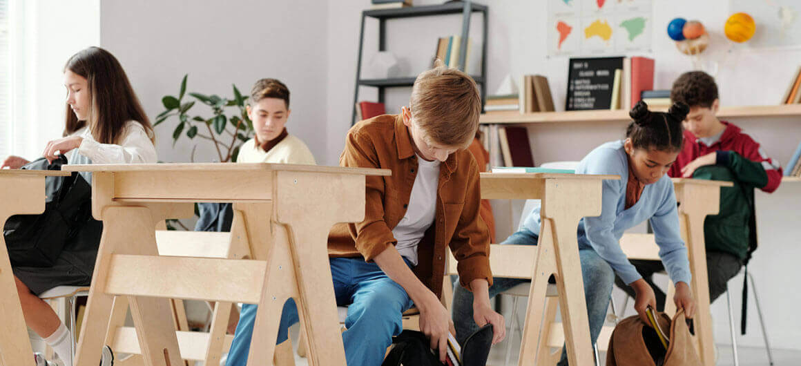 Group of 8th-10th grade students in a classroom setting.